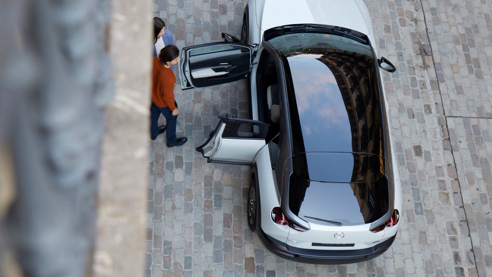 Overhead view of the car doors opening.